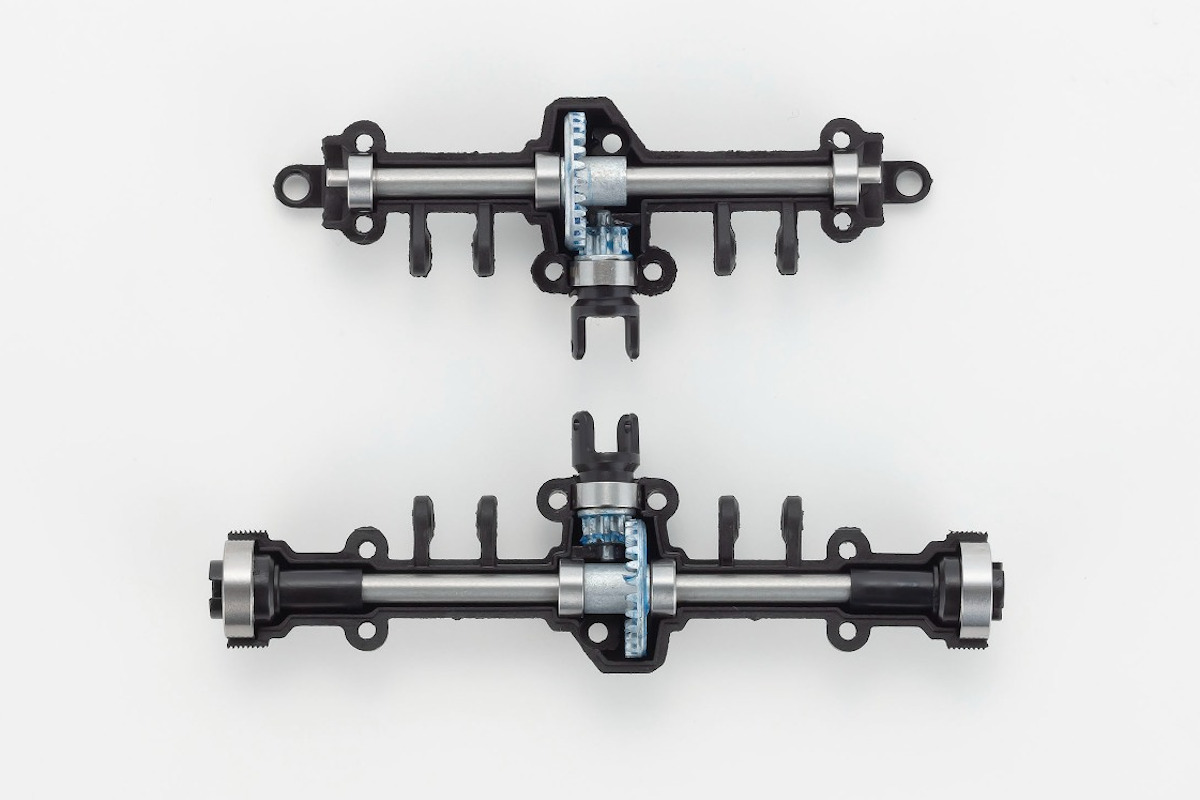 MX-01 portal axle detail — the gear reduction in each axle housing provides the torque crawlers need